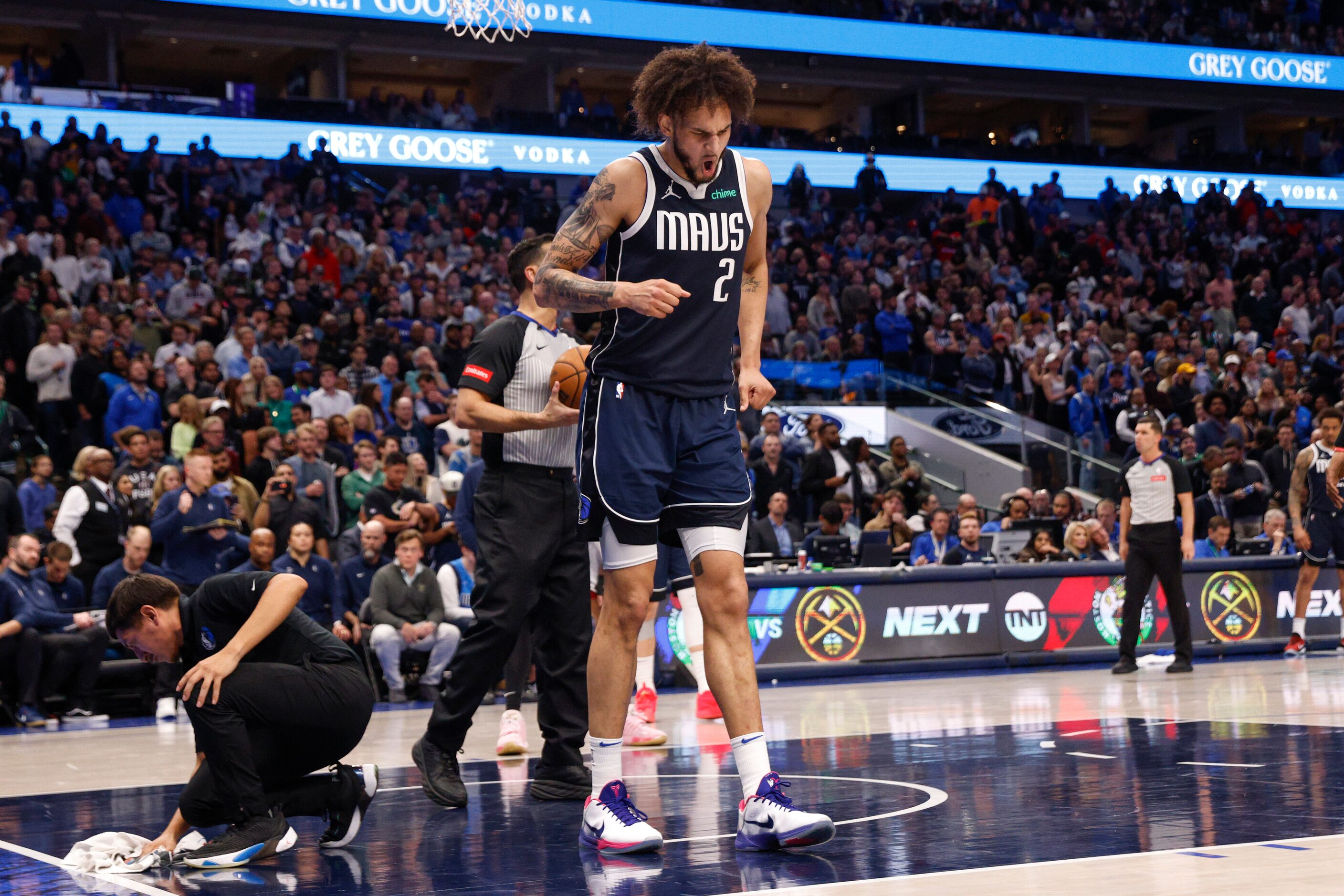 Dallas Mavericks center Dereck Lively II (2) winces after a collision during the second half...