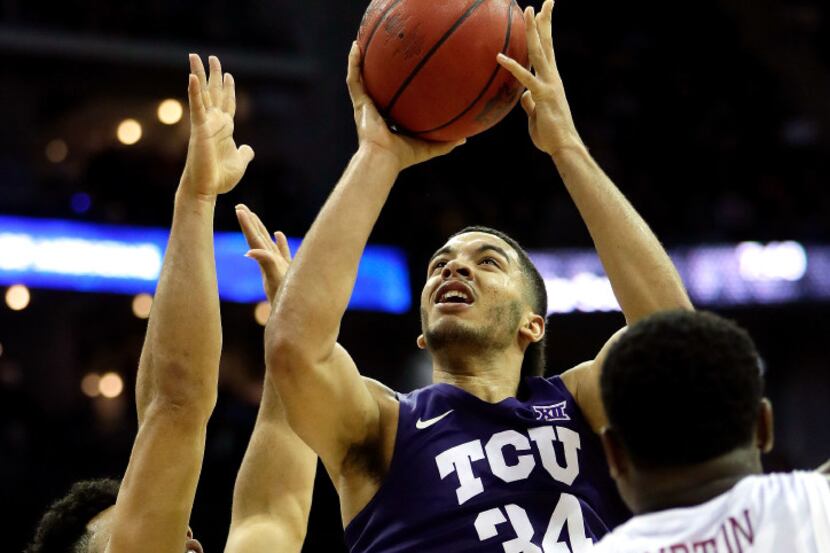 KANSAS CITY, MO - MARCH 10:  Kenrich Williams #34 of the TCU Horned Frogs shoots over Deonte...
