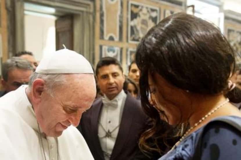 
Pope Francis blesses the belly of a pregnant woman during a meeting with Italy’s abortion...