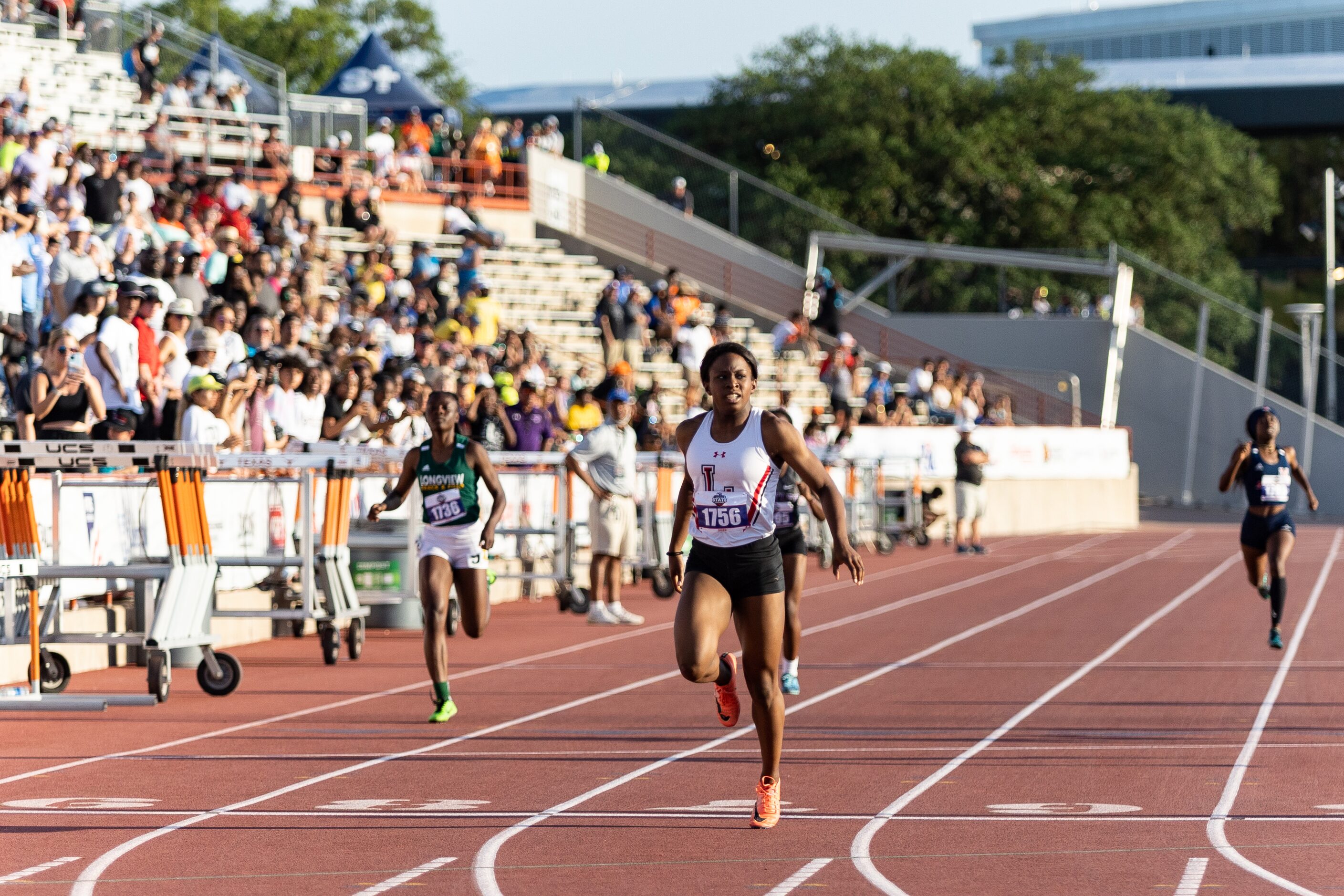 Christine Mallard of Mansfield Legacy crosses the finish line during the girls’ 400m dash at...