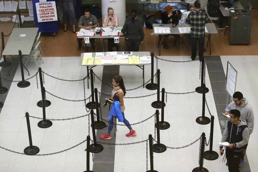 Voters walk through a polling station in Dallas.