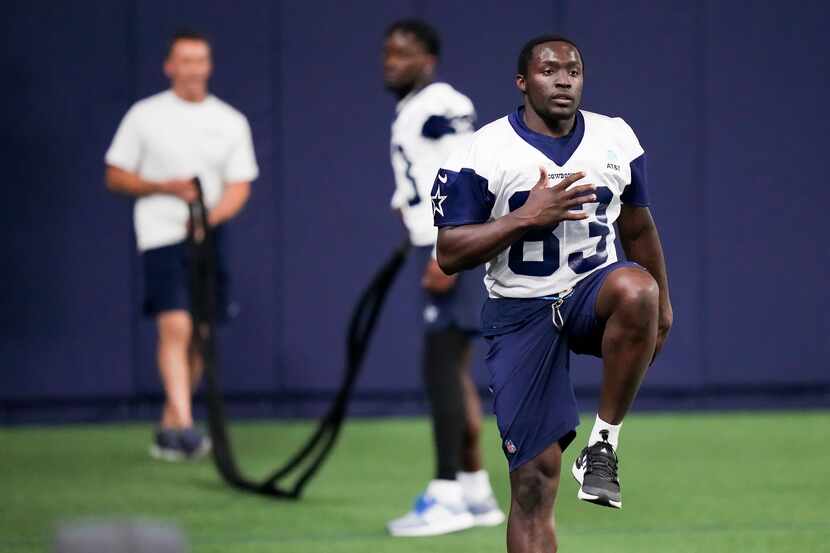Dallas Cowboys wide receiver James Washington (83) works on conditioning during the OTA...