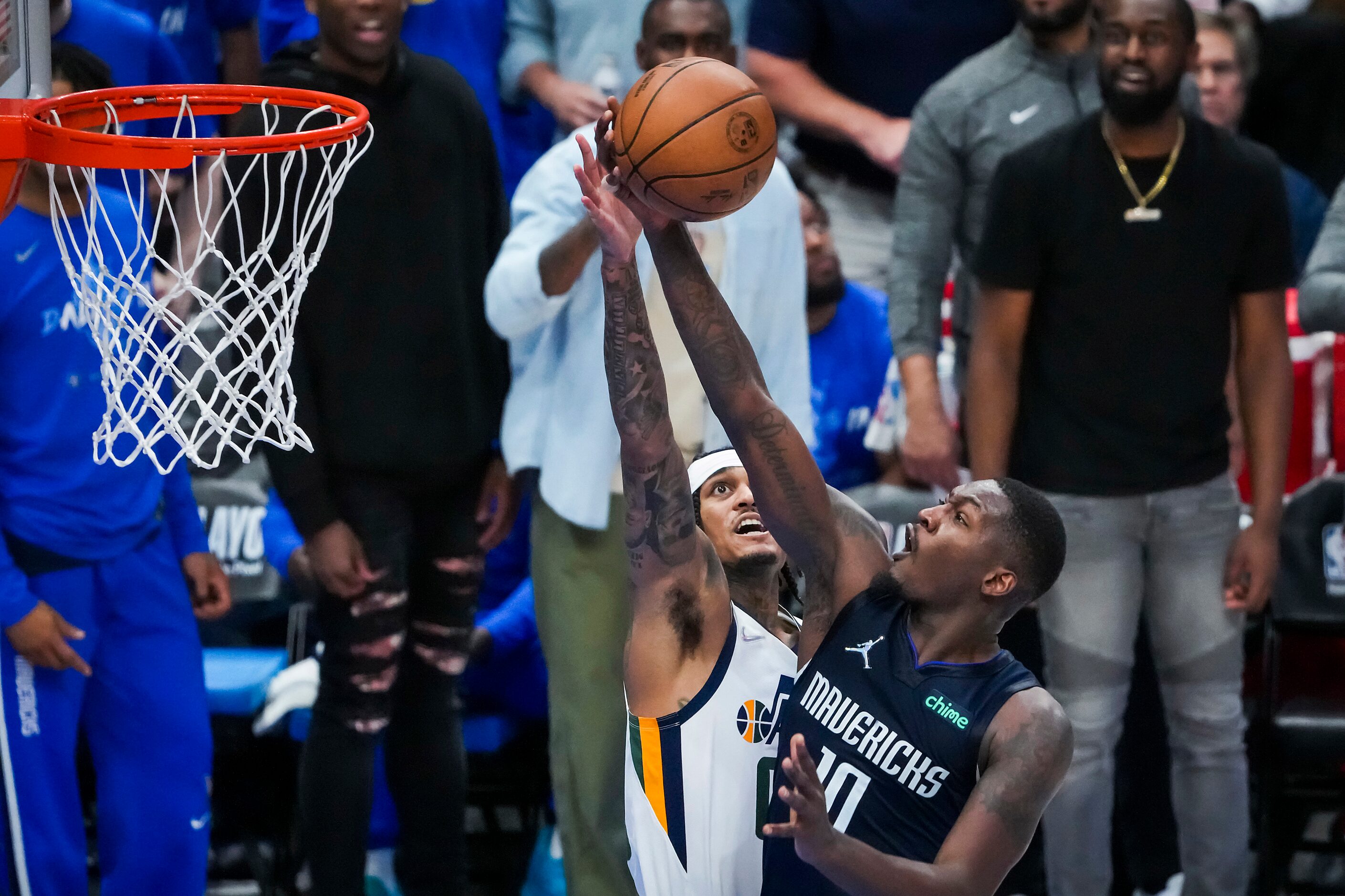 Dallas Mavericks forward Dorian Finney-Smith (10) scores past Utah Jazz guard Jordan...