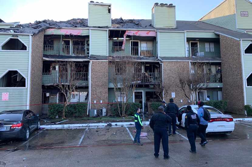 Dallas Fire-Rescue works the aftermath of a fire at the Sable Ridge Condominiums at 6108...