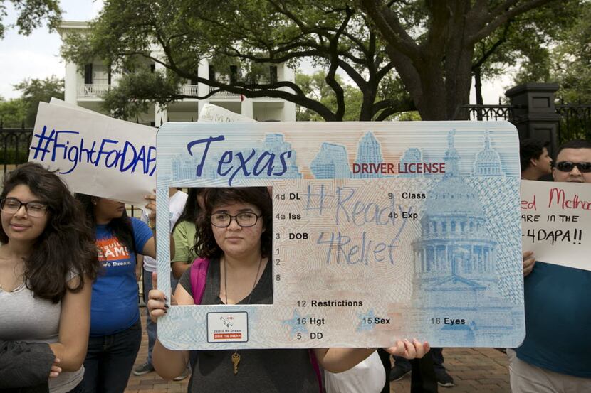 Immigrant rights activists protested outside the Governor's Mansion in Austin in 2015. (File...