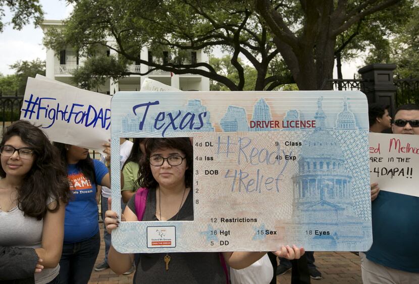 Immigrant rights activists protested outside the Governor's Mansion in Austin in 2015. (File...