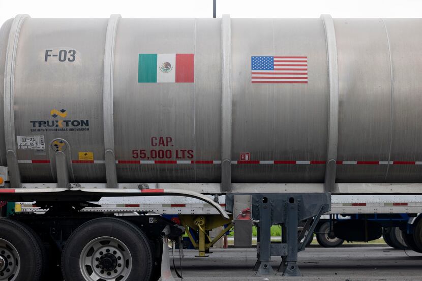 A trailer with Mexican and U.S. flag decals sits at a rest stop near the recently reopened...