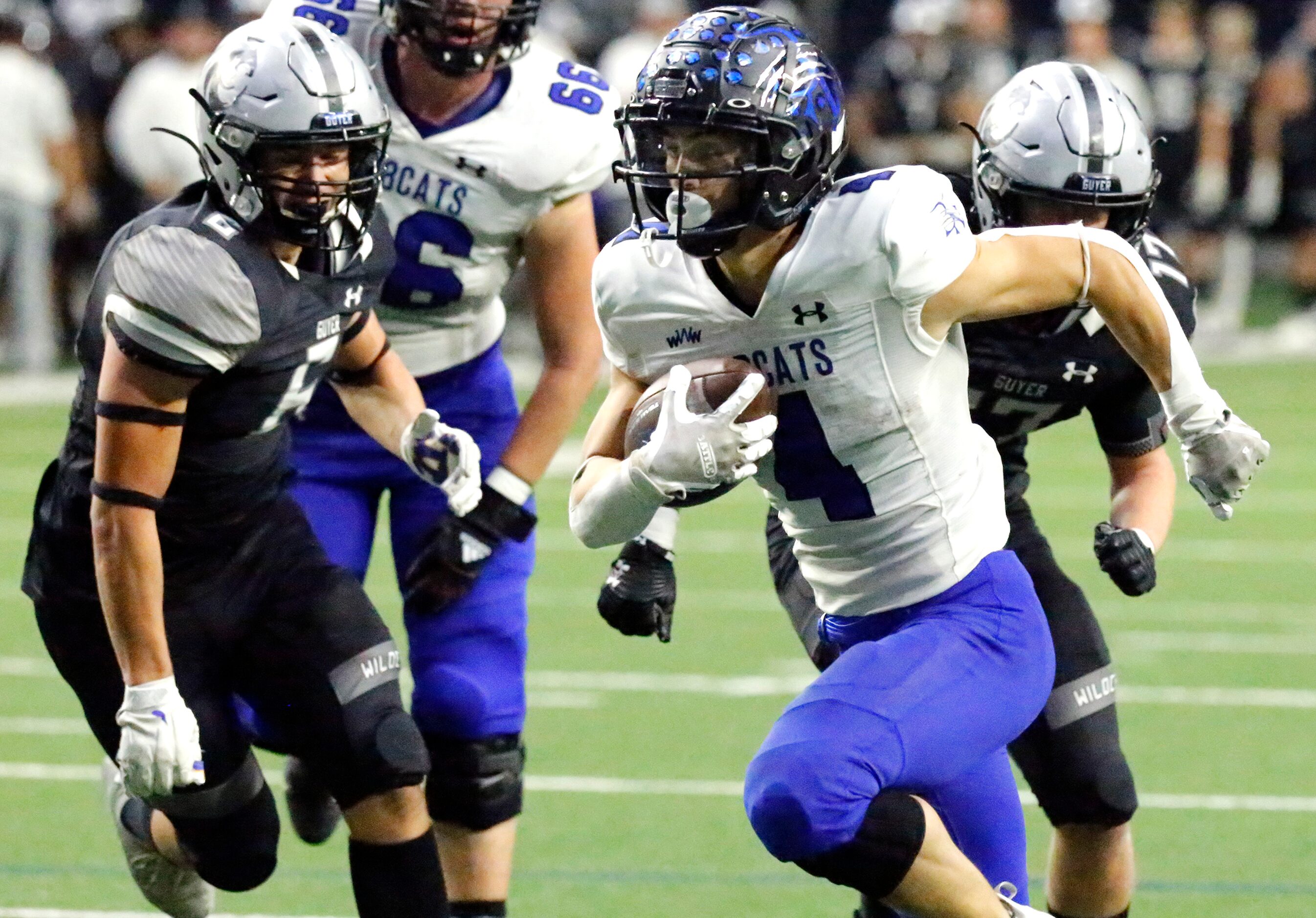 Byron Nelson High School running back Michael Giordano (4) outruns Guyer High School...