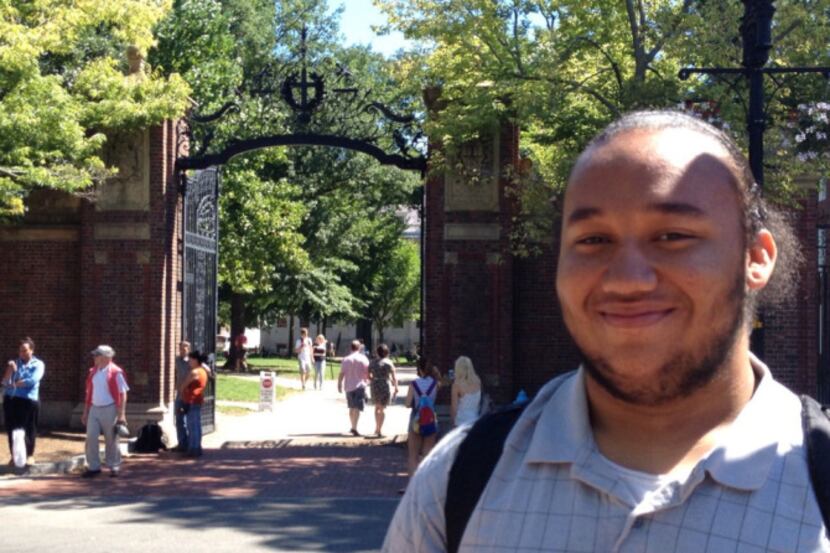 Hutchins teen Reuben Howard stands on Massachusetts Avenue near Harvard University's main...