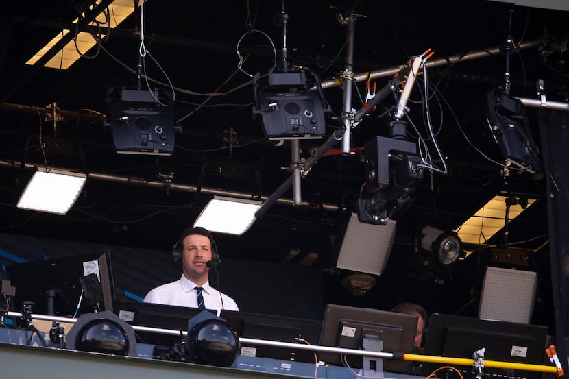 Tony Romo in the broadcast booth during the first half of an NFL football game between the...