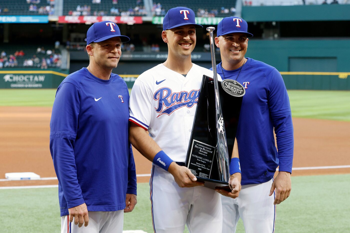 Texas Rangers hitting coach Tim Hyers (left) and bench coach Donnie Ecker (right) present...