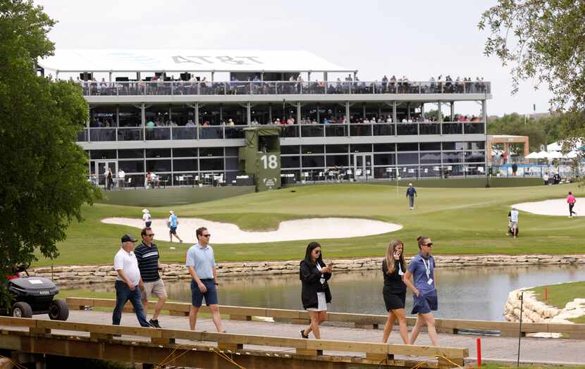 Fans made their way around the course near the 18th hole during the second round of the AT&T...