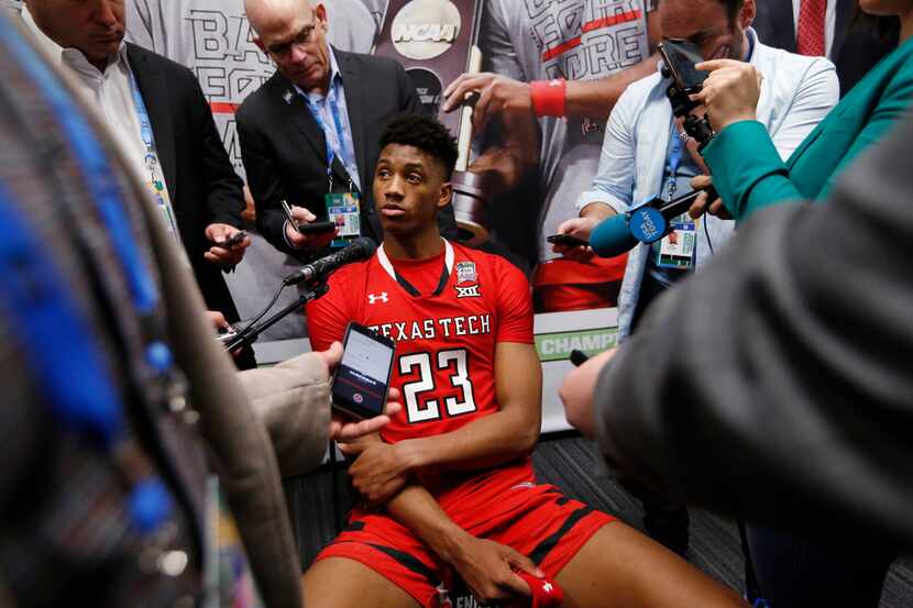 Texas Tech Red Raiders guard Jarrett Culver (23) answers questions from the media in the...