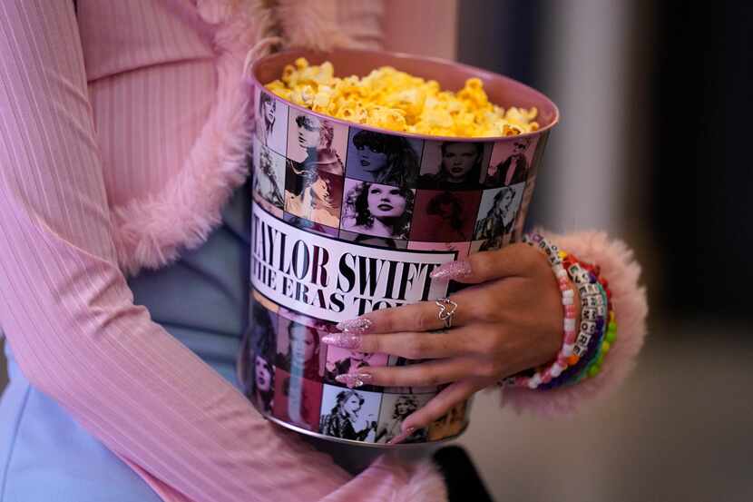 A fan attends the world premiere of the concert film "Taylor Swift: The Eras Tour" on...