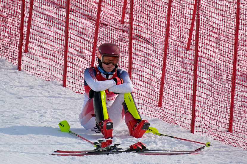 Mikaela Shiffrin, of the United States sits on the side of the course after skiing out in...