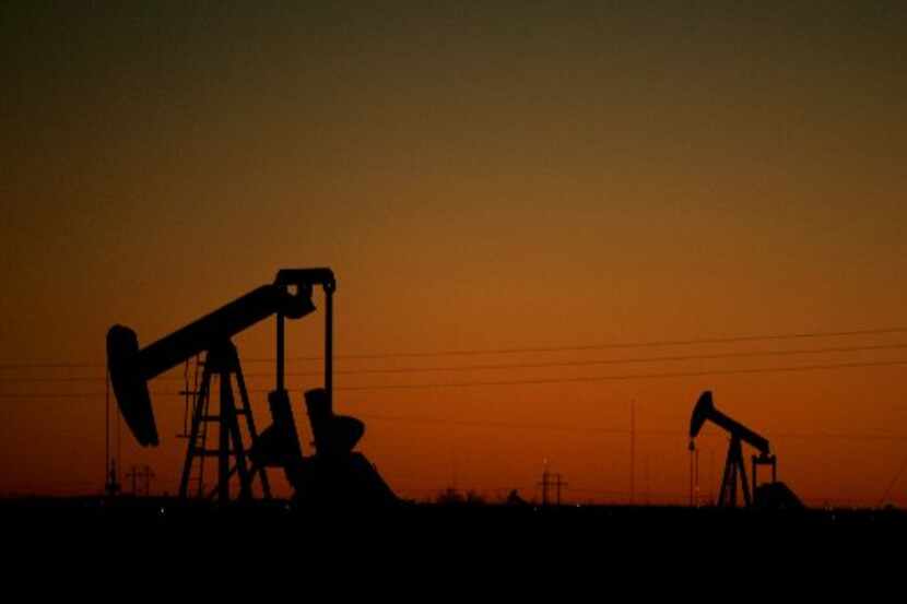  Pump jacks are seen against the evening sky near  Odessa. (File photo)