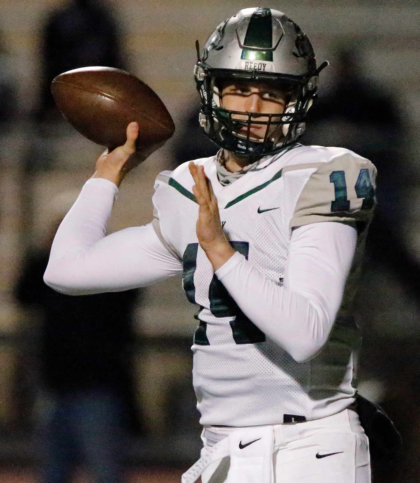 Reedy High School quarterback A.J. Padgett (14) throws a pass during the first half as The...