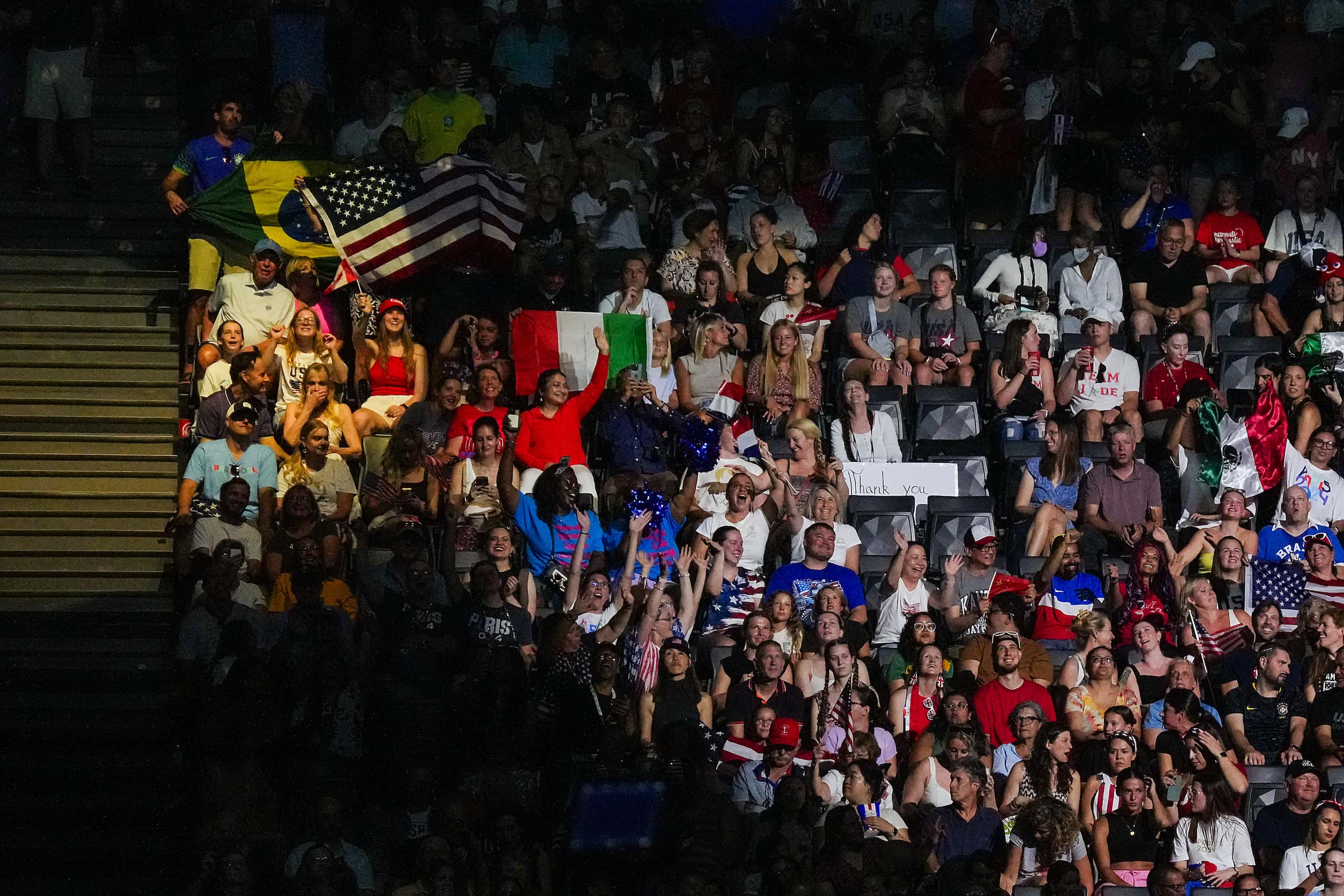 Fans cheer before the women’s gymnastics team final at the 2024 Summer Olympics on Tuesday,...