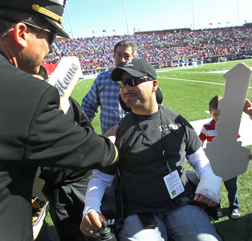 Army Specialist Augustine Pena was greeted by well-wishers after he learned he was getting a...
