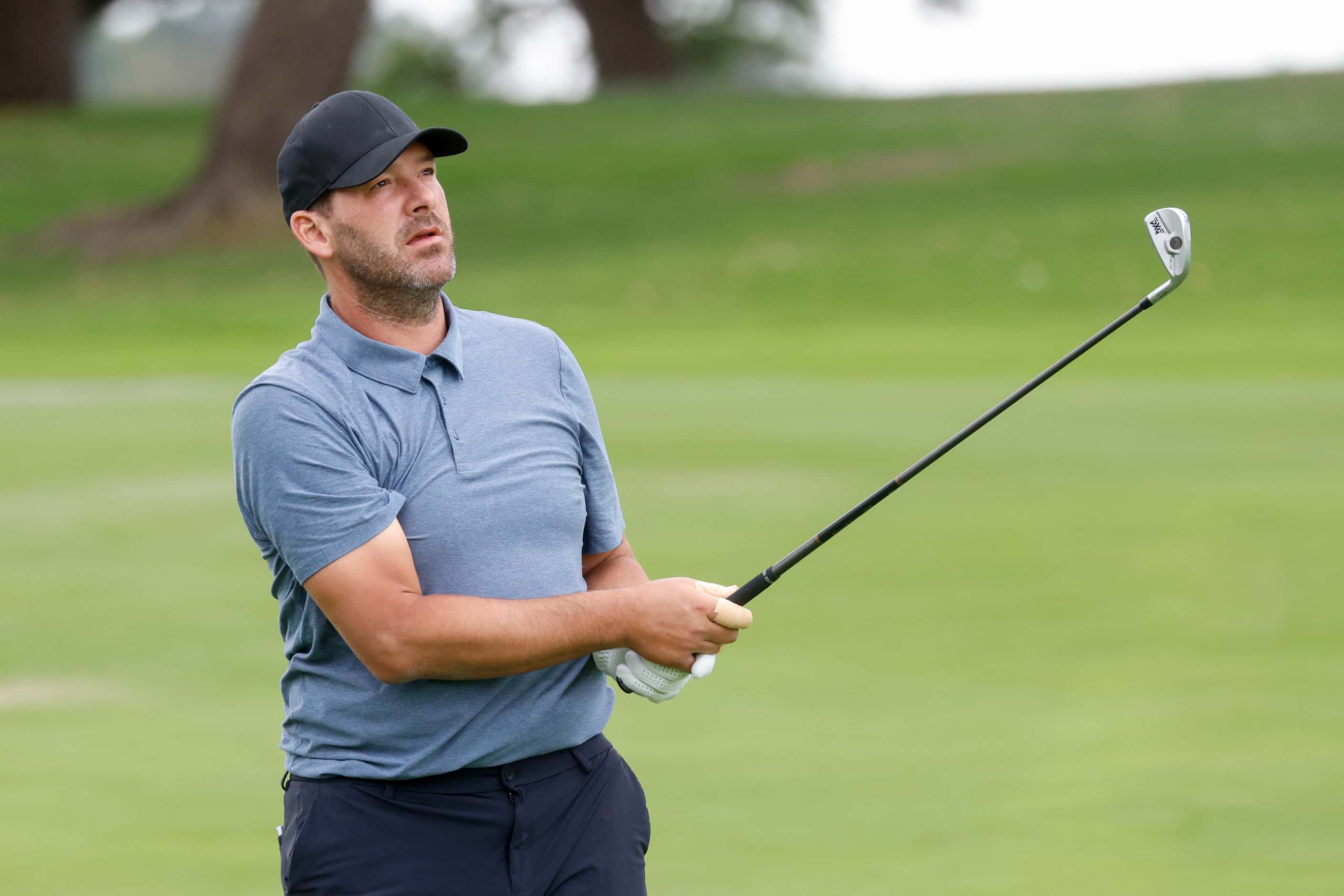 Former Dallas Cowboys quarterback Tony Romo watches his shot from the 9th fairway during the...