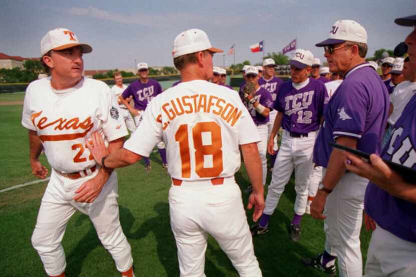From 1996, University of Texas coach Cliff Gustafson (18) pushes first base coach Tommy...