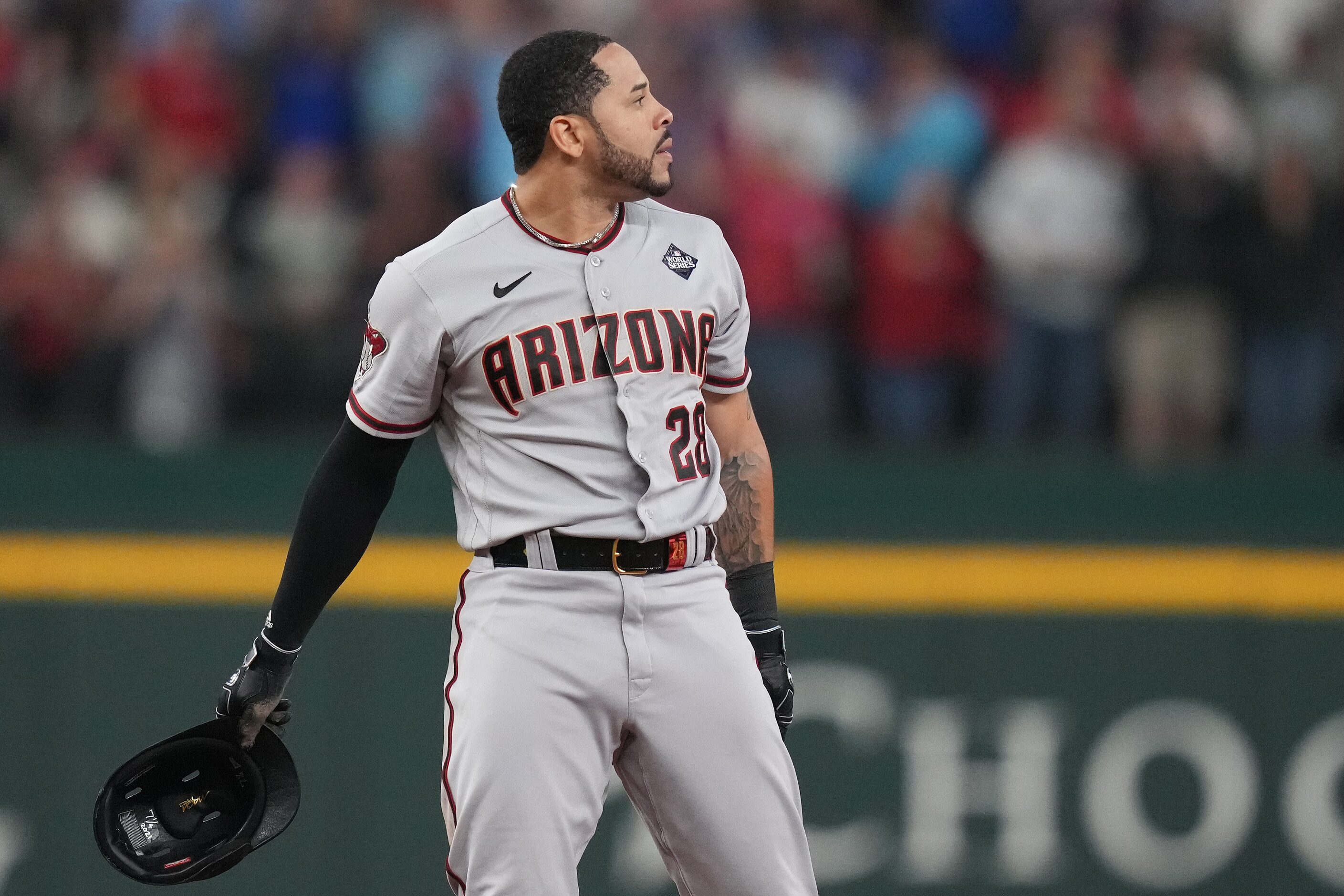 Arizona Diamondbacks designated hitter Tommy Pham (28) reacts after being picked off at...