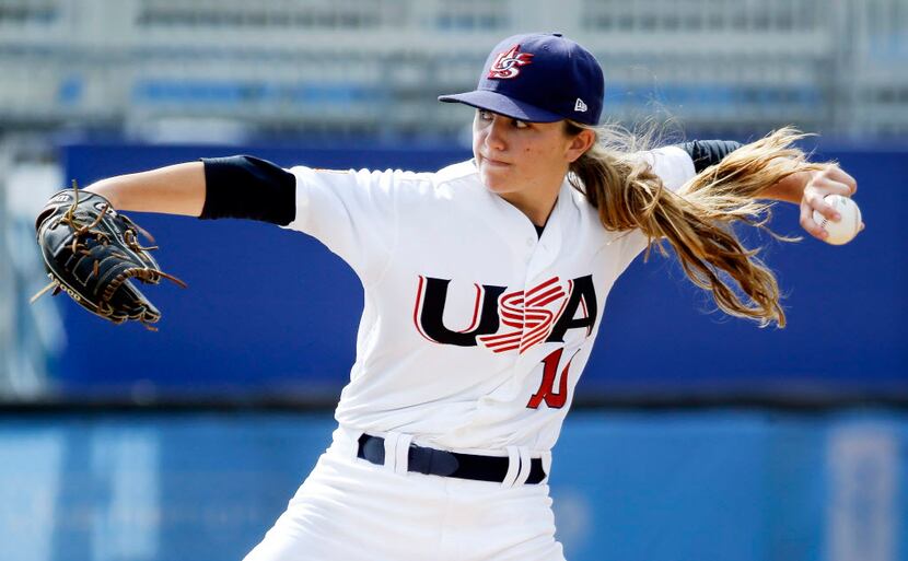 Pitcher Sarah Hudek, of the United States, throws during a women's baseball game against...