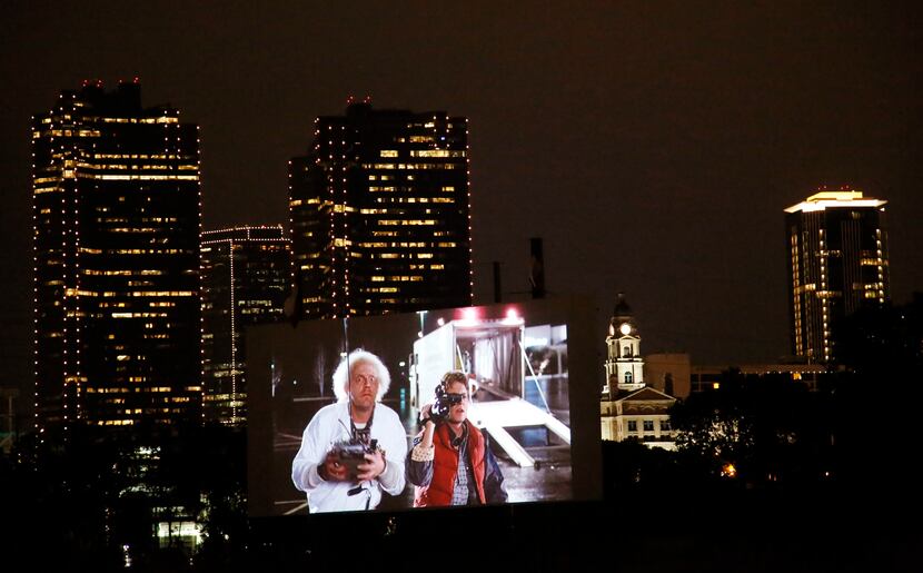 
People watch the movie "Back To The Future" at the Coyote Drive-In in Fort Worth, TX on May...