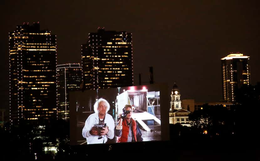 
People watch the movie "Back To The Future" at the Coyote Drive-In in Fort Worth, TX on May...
