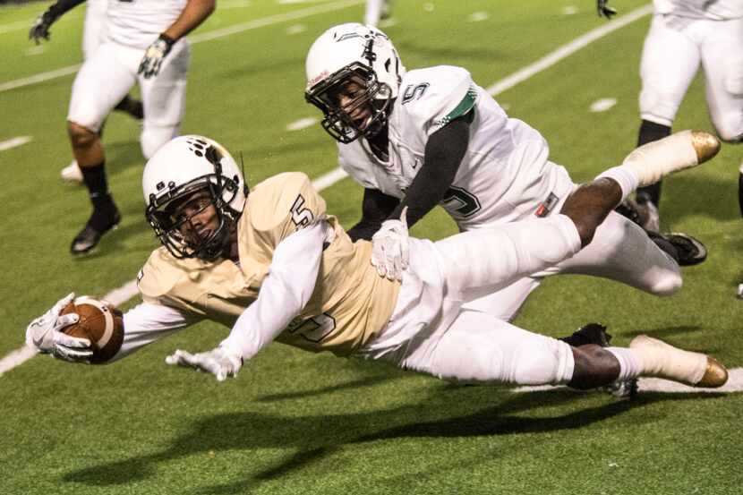 South Oak Cliff wide receiver Markise King (5) dives forward for extra yards during the...