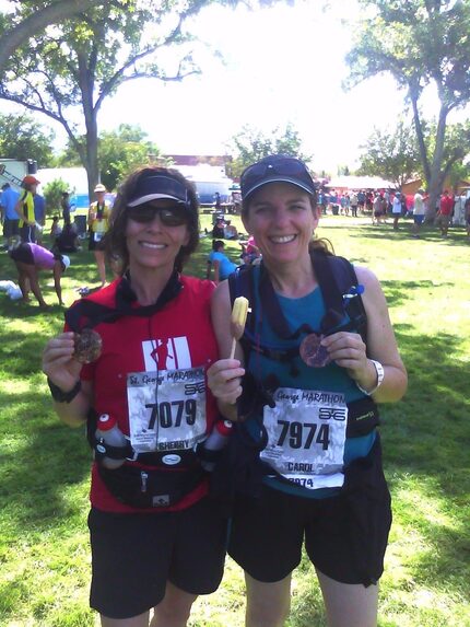 After completing her first marathon in 2011, Carol Hughes, right, poses with her sister,...