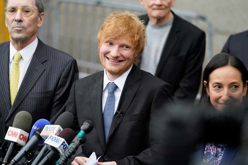 Recording artist Ed Sheeran prepares to speak to the media outside New York Federal Court...