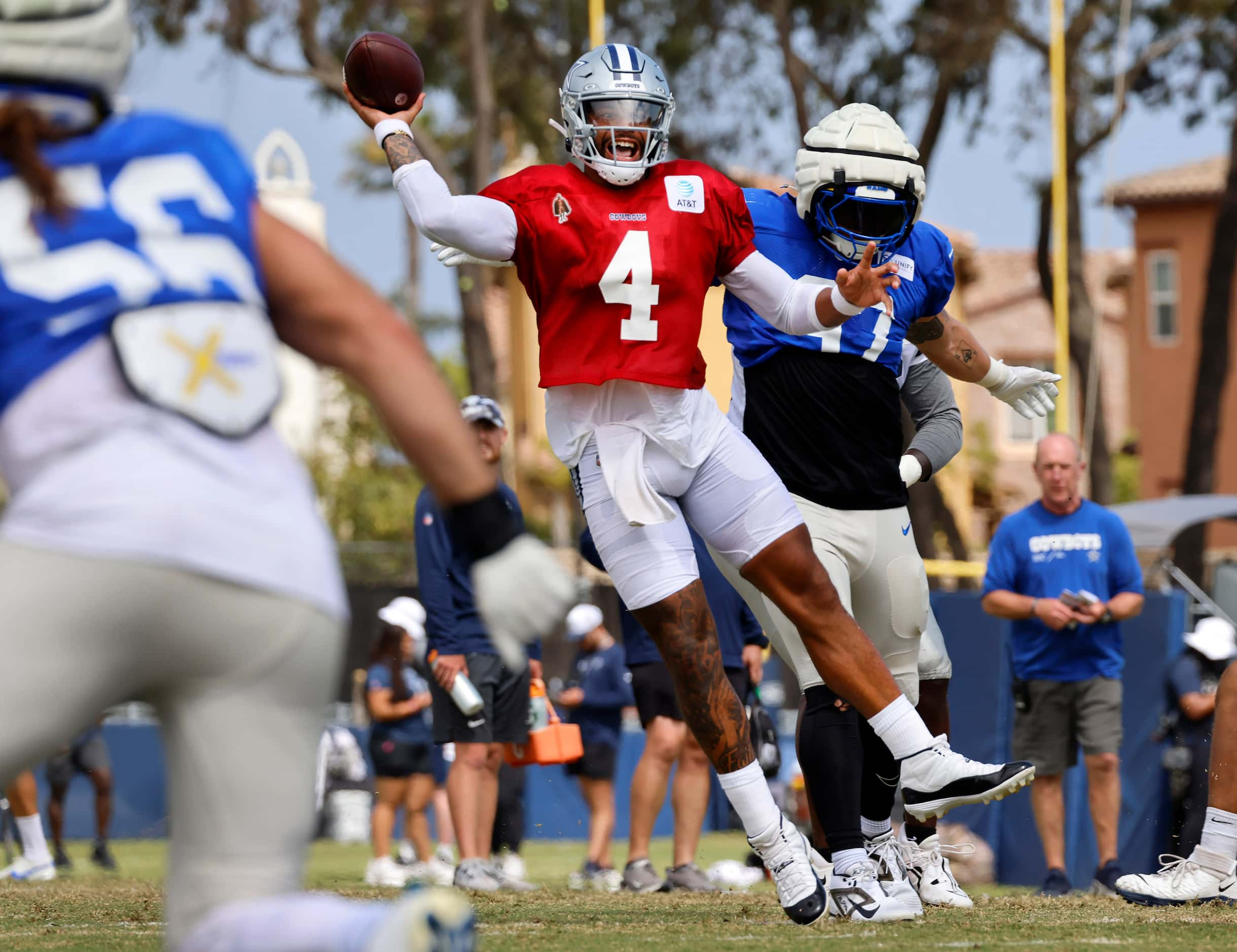 Dallas Cowboys quarterback Dak Prescott (4) throws on the run during a red zone play against...