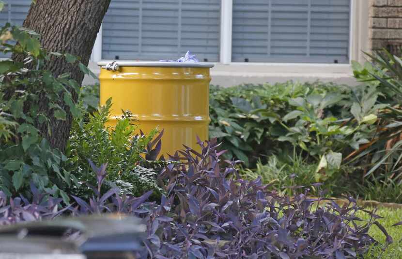 A barrel for disposal of hazardous waste stand by at the residence at 5700 block of ...