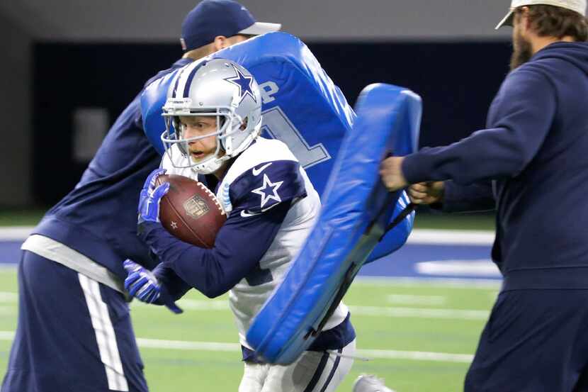 Dallas Cowboys wide receiver Cole Beasley (11) goes through receiving drills during practice...