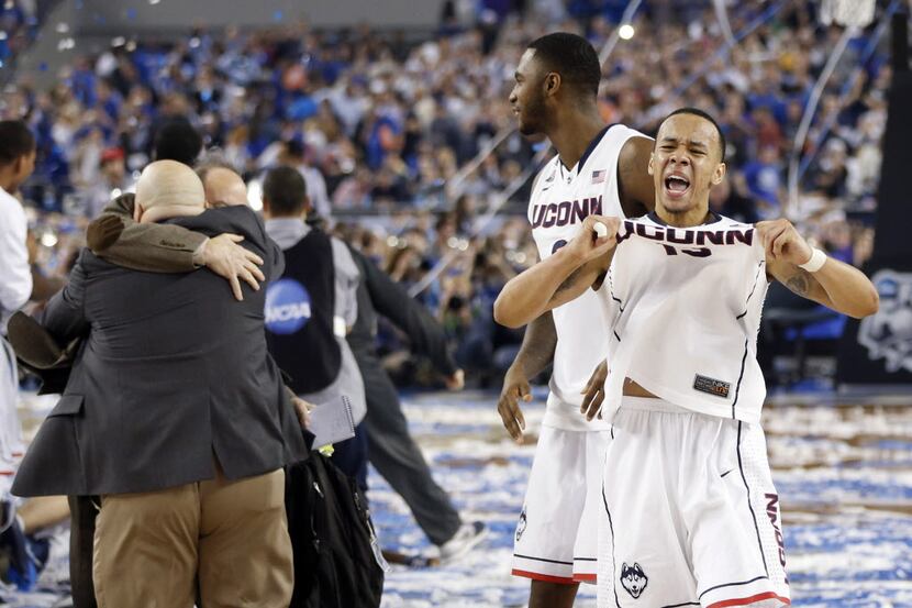 Connecticut Huskies guard Shabazz Napier (13) celebrates a 60-54 win over the Kentucky...