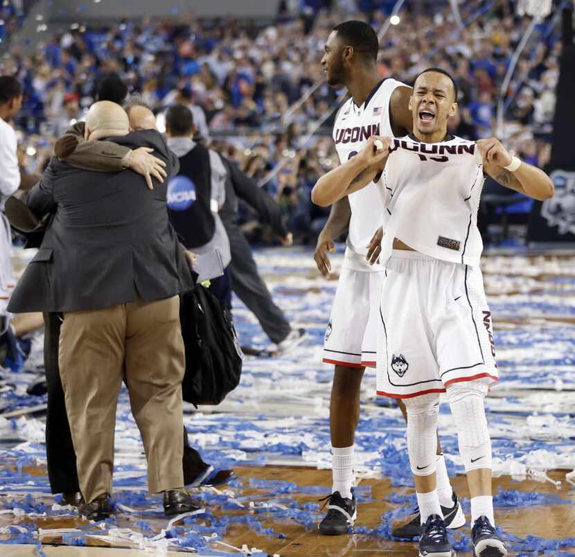 Connecticut Huskies guard Shabazz Napier (13) celebrates a 60-54 win over the Kentucky...