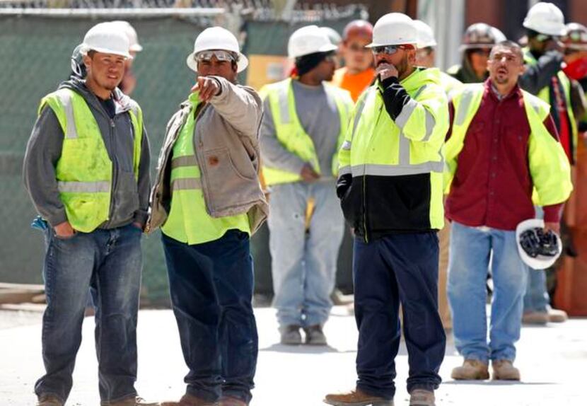 
Construction workers watched where a gunman held police at bay.

