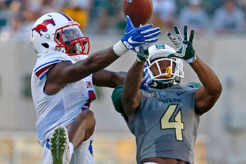 Baylor cornerback Grayland Arnold (4) breaks up a pass intended for Southern Methodist wide...