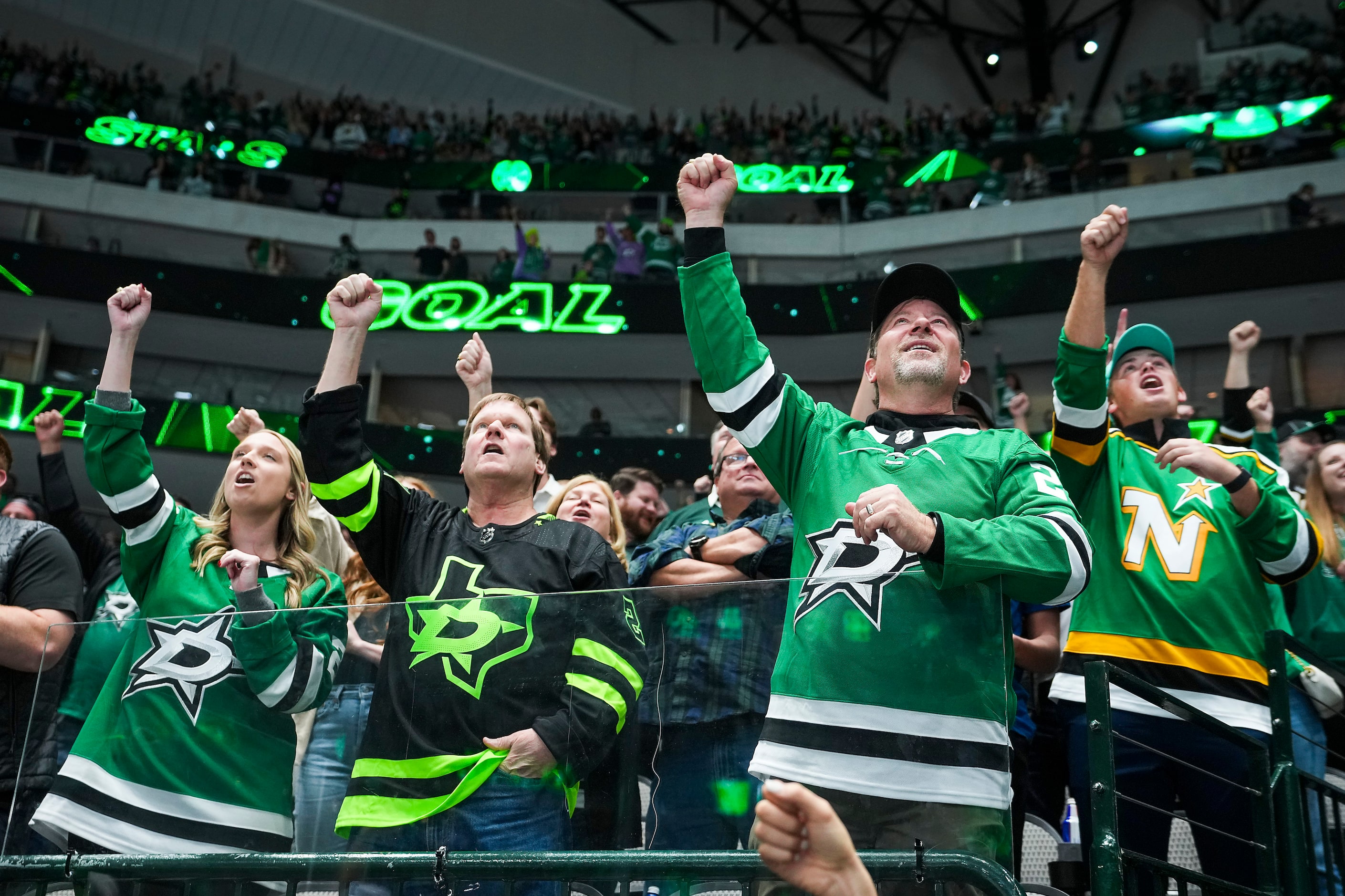 Dallas Stars fans cheer a goal by left wing Jason Robertson during the first period of an...