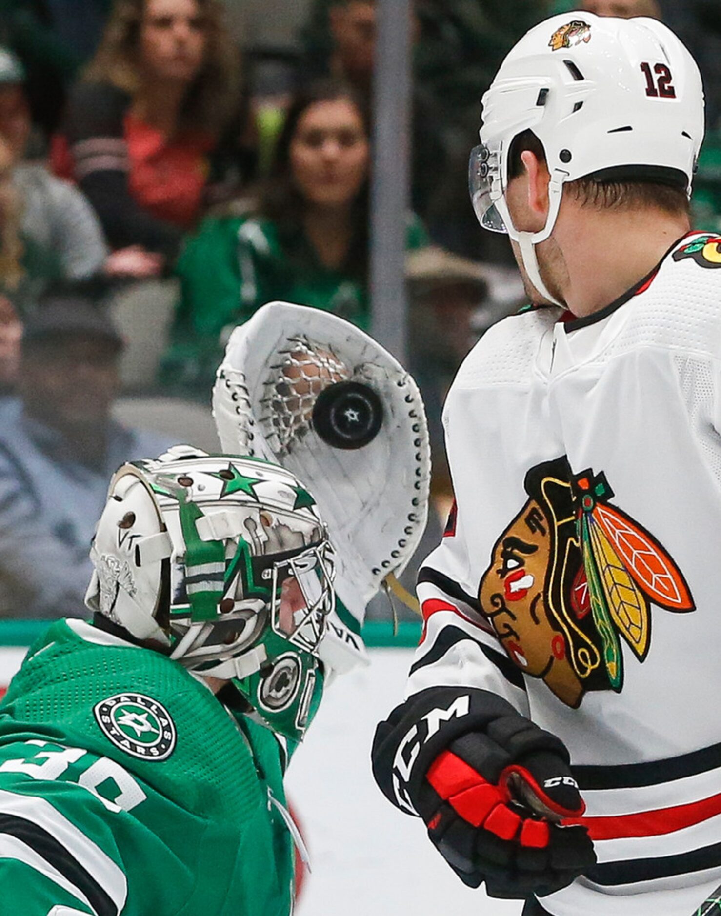 Dallas Stars goaltender Anton Khudobin (35) makes a save past Chicago Blackhawks left wing...