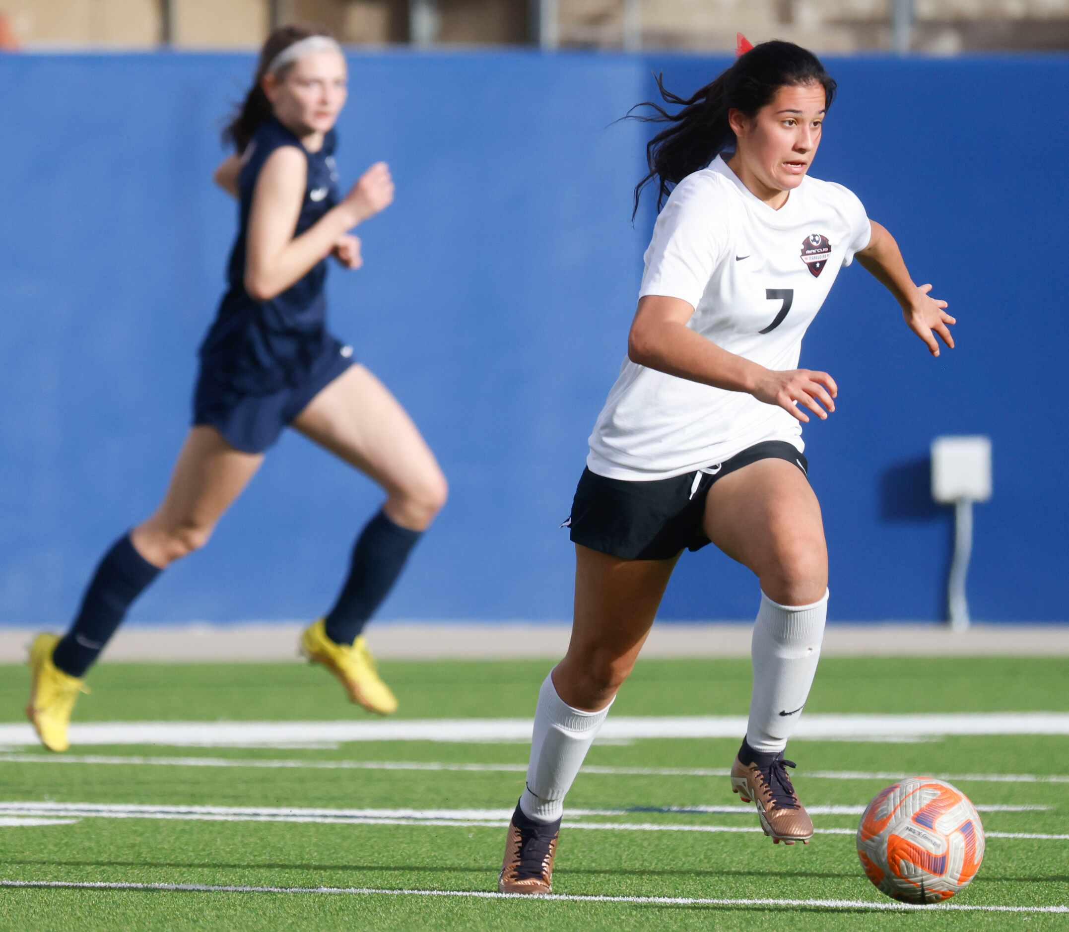 Marcus’ Bella Campos runs with the ball against Allen high during the first half of a...