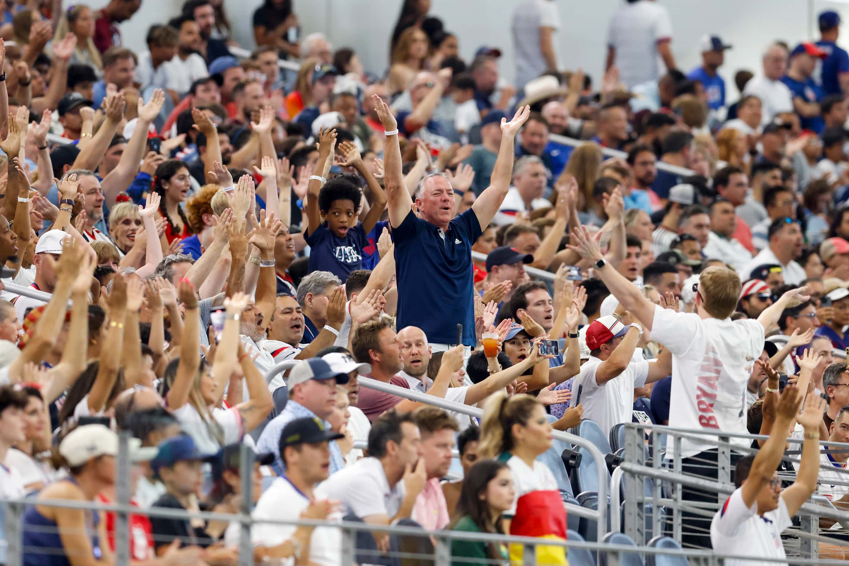 United States soccer fans stand and clap during the second half of a Copa America Group C...