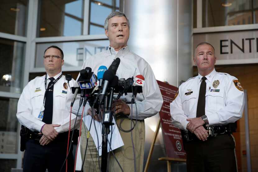 St. Louis County Prosecutor Robert McCulloch, center, speaks during a news conference along...