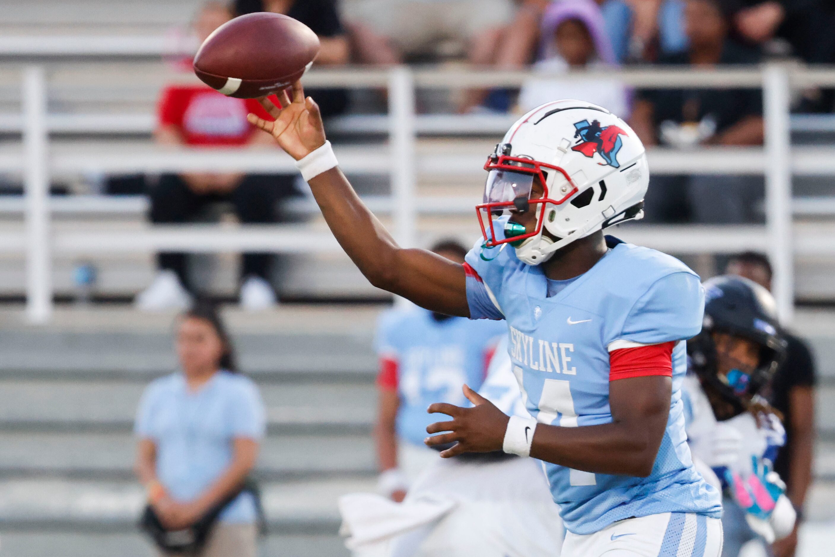 Skyline High’s Donte Ware throws the ball during the first half of a football game against...