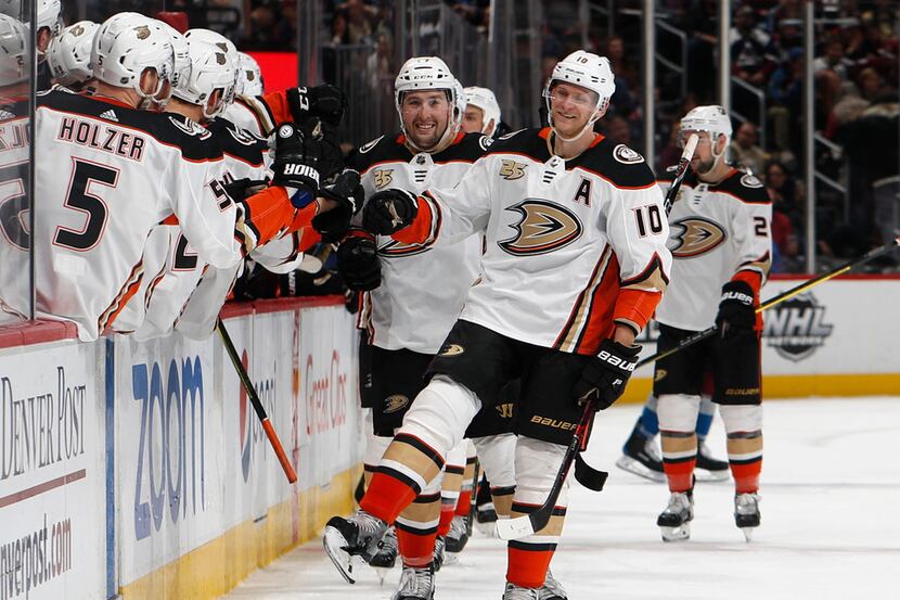 FILE - In this March 15, 2019, file photo, Anaheim Ducks right wing Corey Perry, right, is...