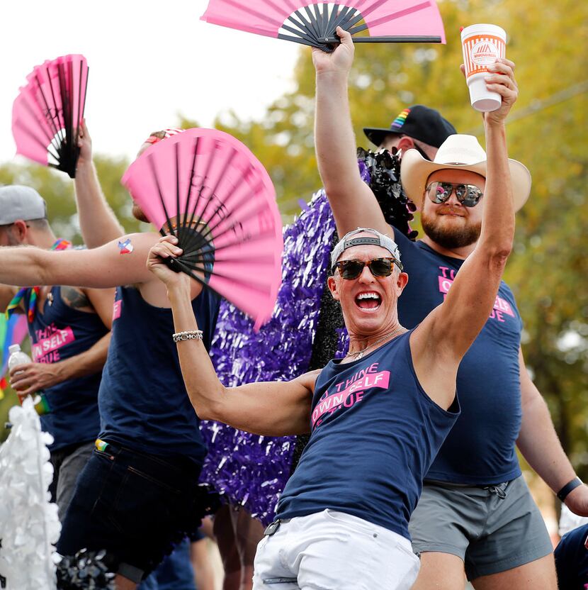 Men dance on a Black Tie Dinner, Inc. float during the Texas Freedom Parade.