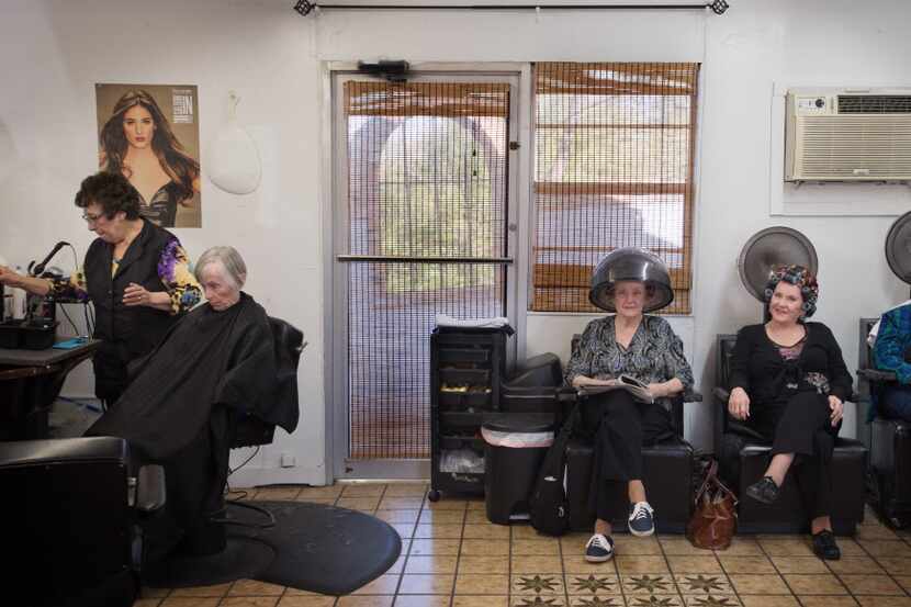  Lupe Gonzalez, far left, on the last day in her hairdressing shop.