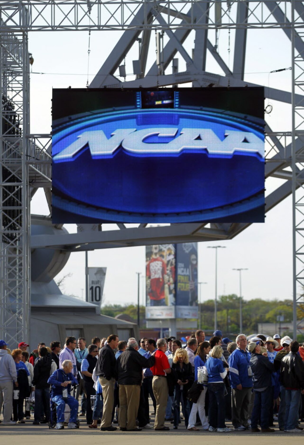 Basketball fans file into AT&T Stadium in Arlington for the NCAA National Basketball...