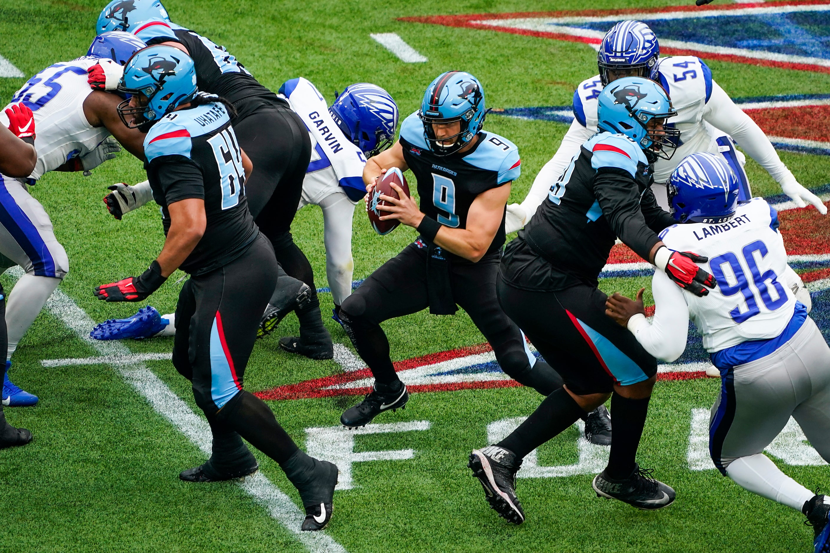 Dallas Renegades quarterback Philip Nelson (9) is sacked by St. Louis Battlehawks defensive...